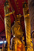 Luang Prabang, Laos - Wat Mai, detail of the Buddha altar inside the sim. 